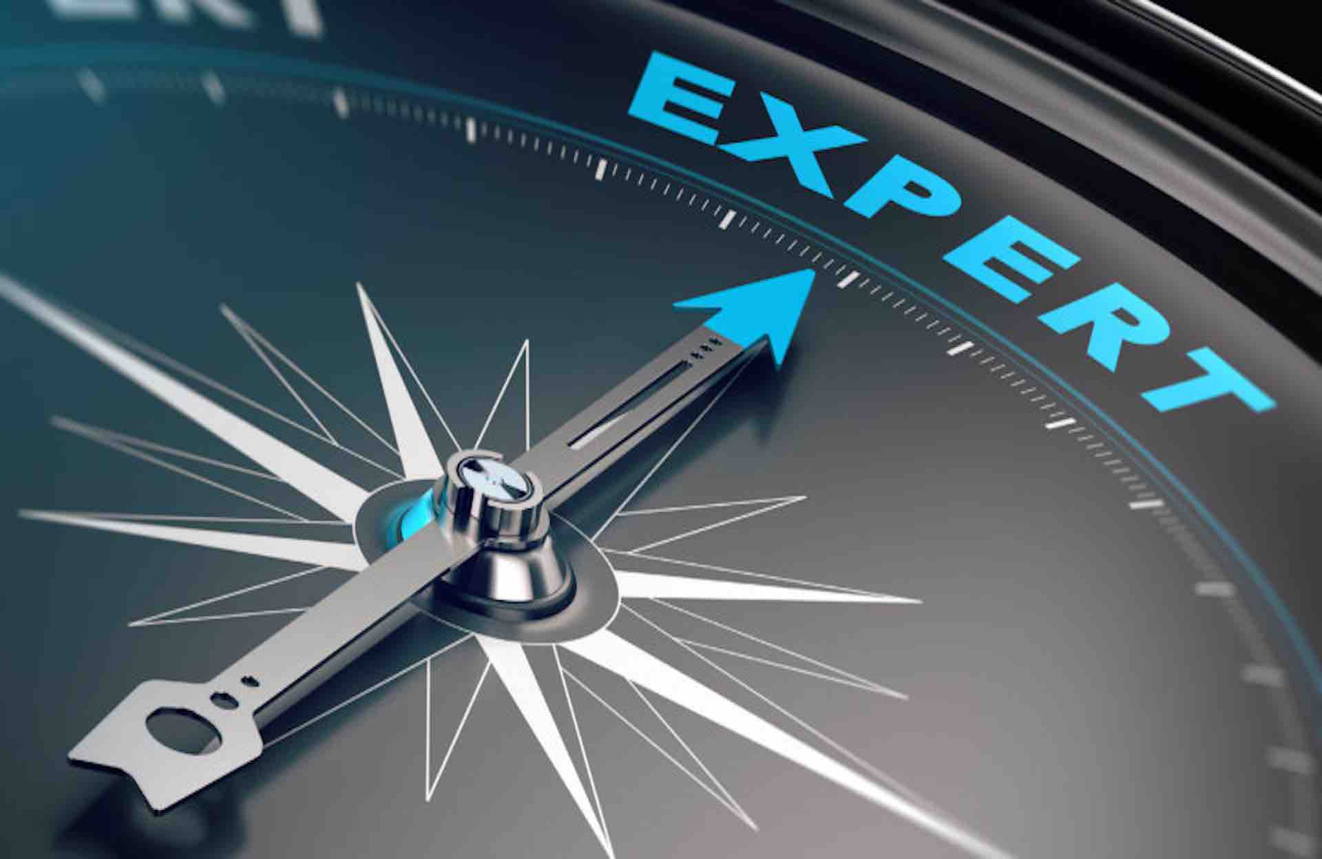 Compass with needle pointing the word expert concept image to illustrate business consulting and advisory.